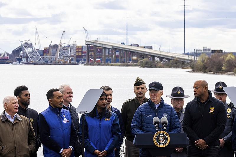 President Joe Biden speaks after an operational briefing on the response and recovery efforts of the collapsed Francis Scott Key Bridge, seen in background, Friday, April 5, 2024, in Dundalk, Md. (AP Photo/Julia Nikhinson)