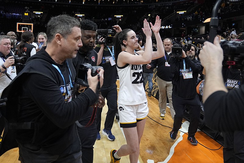 Iowa guard Caitlin Clark (22) walks off the court after a Final Four college basketball game against UConn in the women's NCAA Tournament, Friday, April 5, 2024, in Cleveland. Iowa won 71-69. (AP Photo/Morry Gash)
