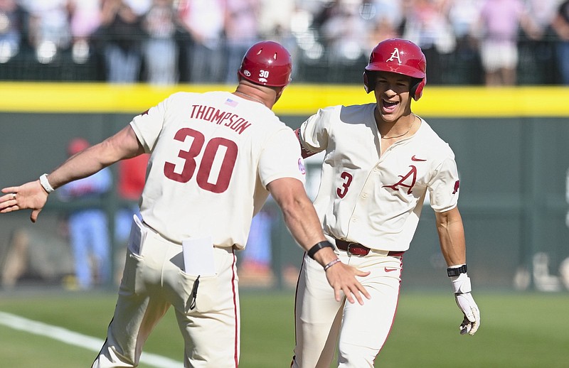 Arkansas' Nolan Souza (3) scores on a home run, batting in two on Saturday, April 6, 2024, during the seventh inning of Game 3 against Ole Miss at Baum-Walker Stadium in Fayetteville. (NWA Democrat-Gazette/Charlie Kaijo)
