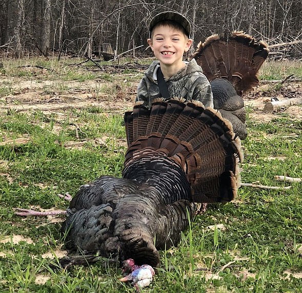 Grady Stahl, 6, was among the young hunters who harvested 3,721 turkeys during youth weekend this past weekend. It was his first harvest. (Photo provided by Missouri Department of Conservation)