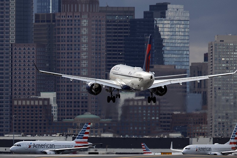 A Delta Air Lines jet lands at Logan International Airport in Boston last year.
(AP/Michael Dwyer)