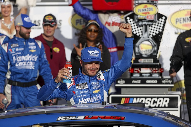 Kyle Larson celebrates March 3 after winning a NASCAR Cup Series race at Las Vegas Motor Speedway in Las Vegas. The 2021 NASCAR Cup champion is going to attempt to complete the Memorial Day weekend double — 1,100 miles of racing in Indianapolis and Charlotte, N.C., on the same day.
(AP/Ian Maule)