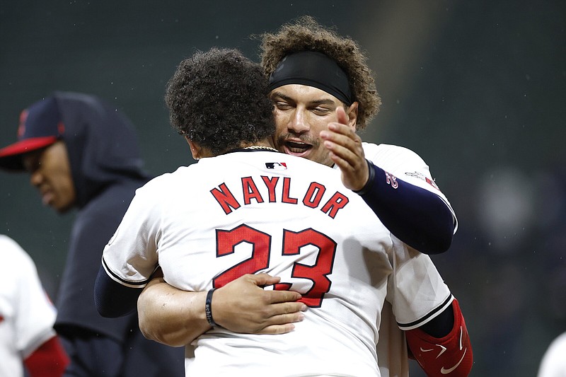 Cleveland’s Bo Naylor (23) celebrates his game-winning RBI single in the 10th inning with his brother, Josh Naylor, on Wednesday in the Guardians’ 7-6 victory. The Naylors added home runs in the fourth inning for Cleveland.
(AP/Ron Schwane)
