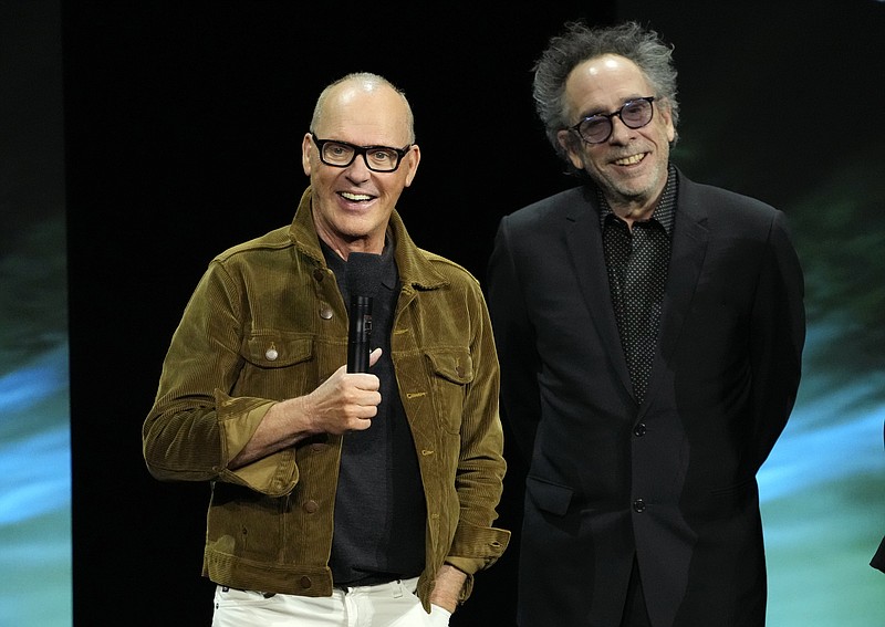 Michael Keaton, left, star of the upcoming film "Beetlejuice Beetlejuice," discusses the film alongside director Tim Burton during the Warner Bros. Pictures presentation at CinemaCon 2024, Tuesday, April 9, 2024, in Las Vegas. (AP Photo/Chris Pizzello)