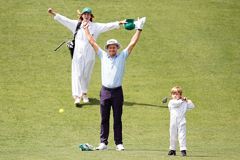 Peter Malnati and his wife Alicia react as their son Hatcher hits the ball on the fifth hole Wednesday during the Par 3 Contest at the Masters at Augusta National Golf Club in Augusta, Ga. (Associated Press)