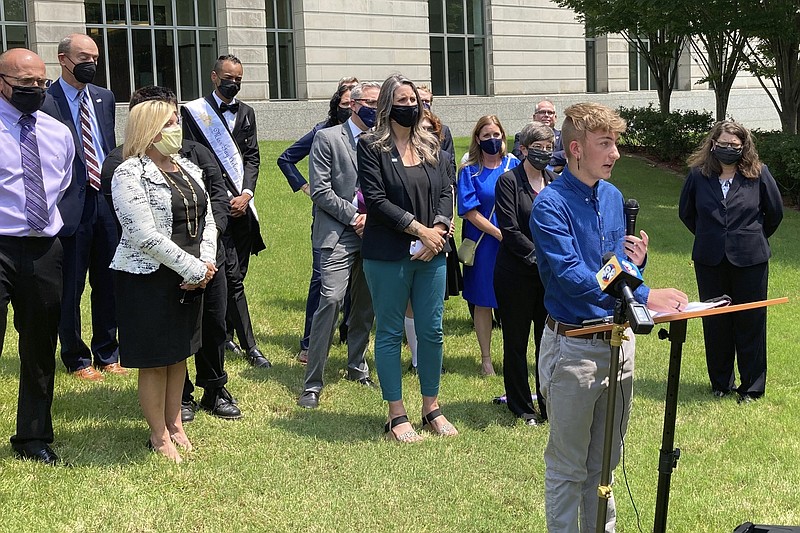 FILE - Dylan Brandt speaks at a news conference outside the federal courthouse in Little Rock, Ark., July 21, 2021. (AP Photo/Andrew DeMillo, File)