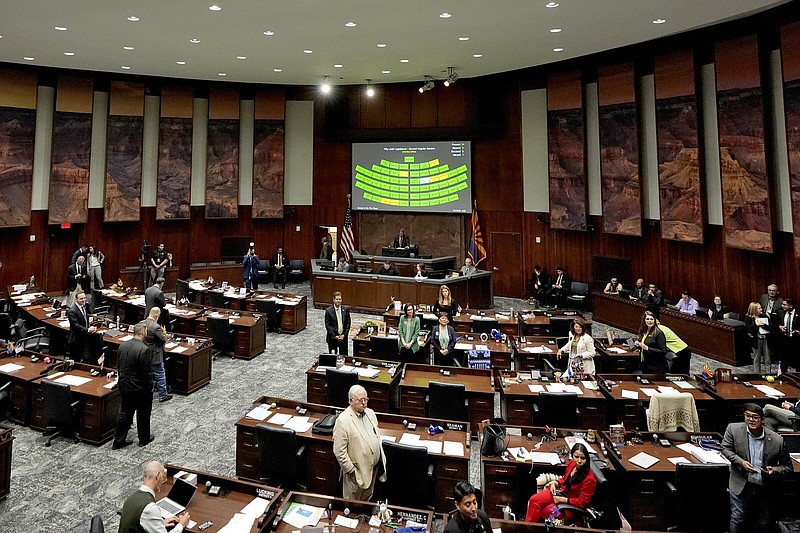 Arizona state representatives convene Wednesday on the House floor at the Capitol in Phoenix, Ariz.
(AP/Matt York)
