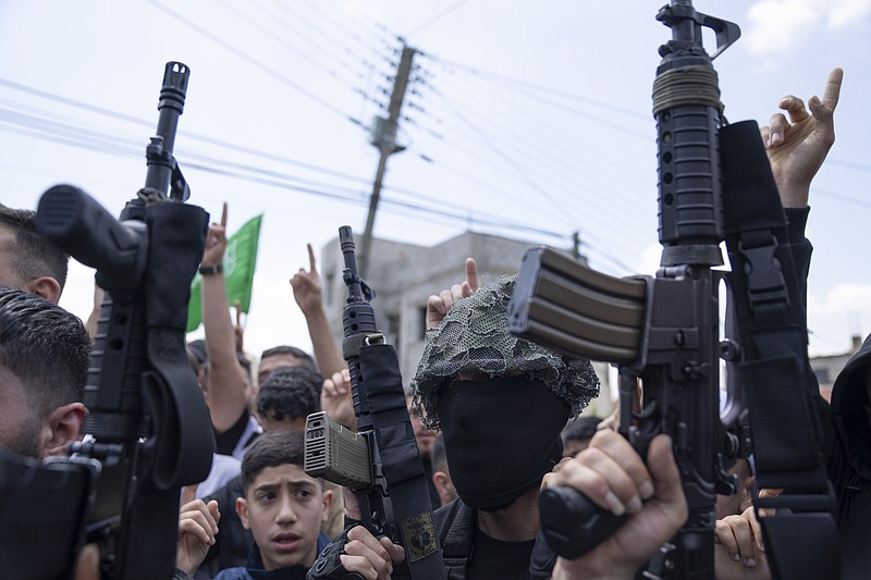 Palestinian gunmen take part in the funeral of Hamas local commander Mohammad Daraghmeh, 26, in the West Bank city of Tubas on Friday.
(AP/Nasser Nasser)