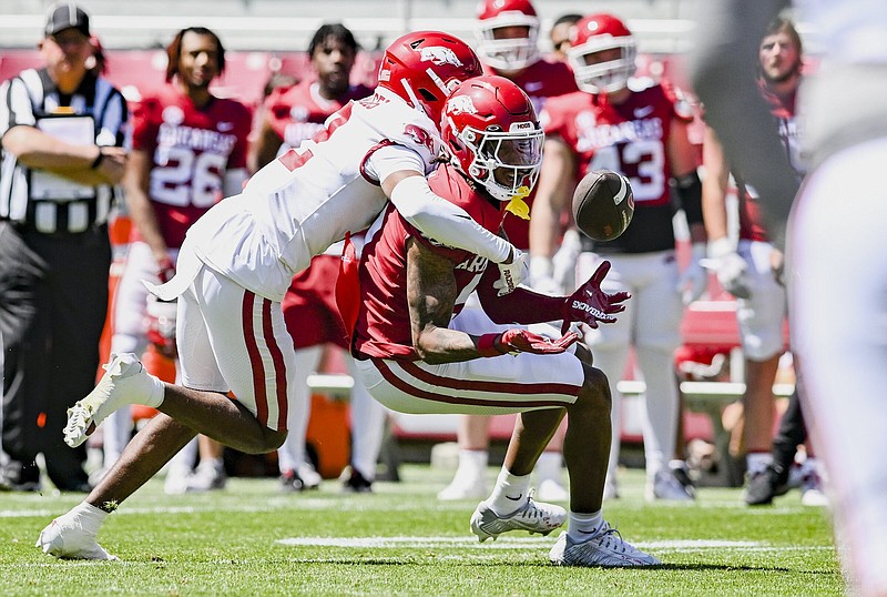 Arkansas wide receiver Tyrone Broden (5) completes a pass, Saturday, April 13, 2024 during the first quarter of the the Red-White Spring game at Reynolds Razorback Stadium in Fayetteville. Visit nwaonline.com/photos for today's photo gallery...(NWA Democrat-Gazette/Charlie Kaijo)