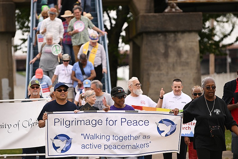 Participants in the Pilgrimage for Peace make their way to the Beacon of Peace in North Little Rock after crossing the Junction Bridge on Sunday, April 14, 2024. More photos at arkansasonline.com/415peace/..(Arkansas Democrat-Gazette/Staci Vandagriff)