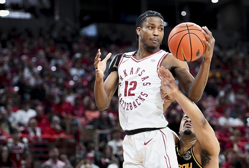 Arkansas guard Tramon Mark (12) rebounds during the second half of a basketball game at Bud Walton Arena in Fayetteville in this Feb. 24, 2024 file photo. (NWA Democrat-Gazette/Charlie Kaijo)