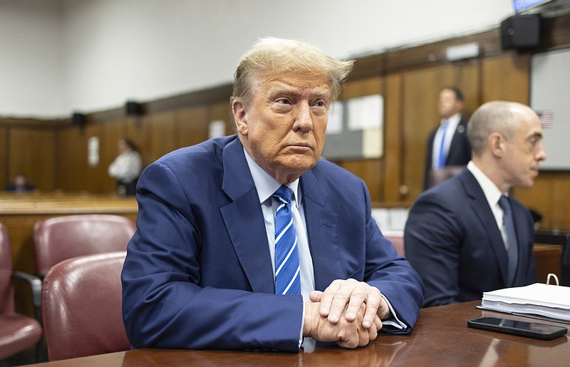 Former President Donald Trump awaits the start of proceedings on the second day of jury selection at Manhattan criminal court, Tuesday, April 16, 2024, in New York. Donald Trump returned to the courtroom Tuesday as a judge works to find a panel of jurors who will decide whether the former president is guilty of criminal charges alleging he falsified business records to cover up a sex scandal during the 2016 campaign. (Justin Lane/Pool Photo via AP)