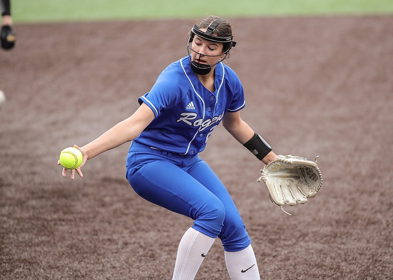 Rogers Mounties Lauryn Heinle fields a ball during the Bentonville at Rogers softball game, April 27, 2023. (Special to NWA Democrat-Gazette/Brent Soule)