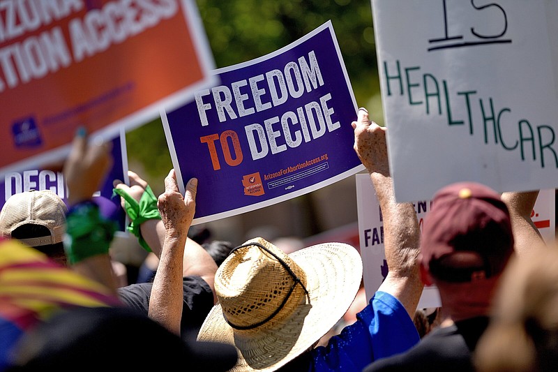 Abortion rights supporters gather outside the Capitol in Phoenix on Wednesday.
(AP/Matt York)