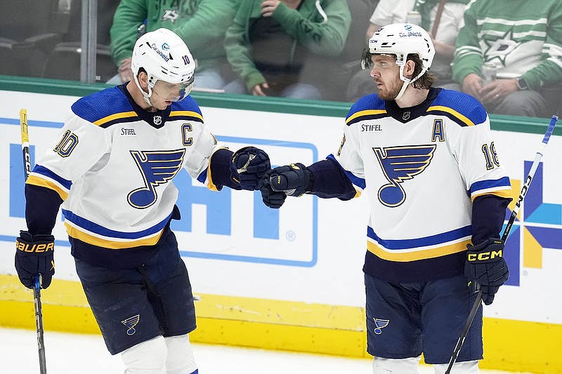 Blues teammates Brayden Schenn (left) and Robert Thomas celebrate after Thomas scored during Wednesday night's game against the Stars in Dallas. (Associated Press)