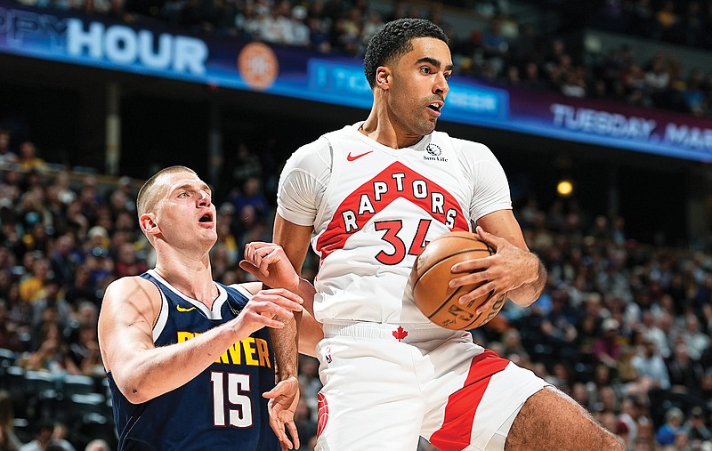 In this March 11 file photo, Jontay Porter pulls in a rebound for the Raptors during their game against the Nuggets in Denver. (Associated Press)