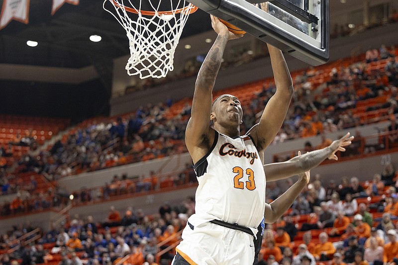 Oklahoma State center Brandon Garrison (23) shoots in the second half of the NCAA college basketball game against BYU, Saturday, Feb. 17, 2024, in Stillwater, Okla. (AP Photo/Mitch Alcala)