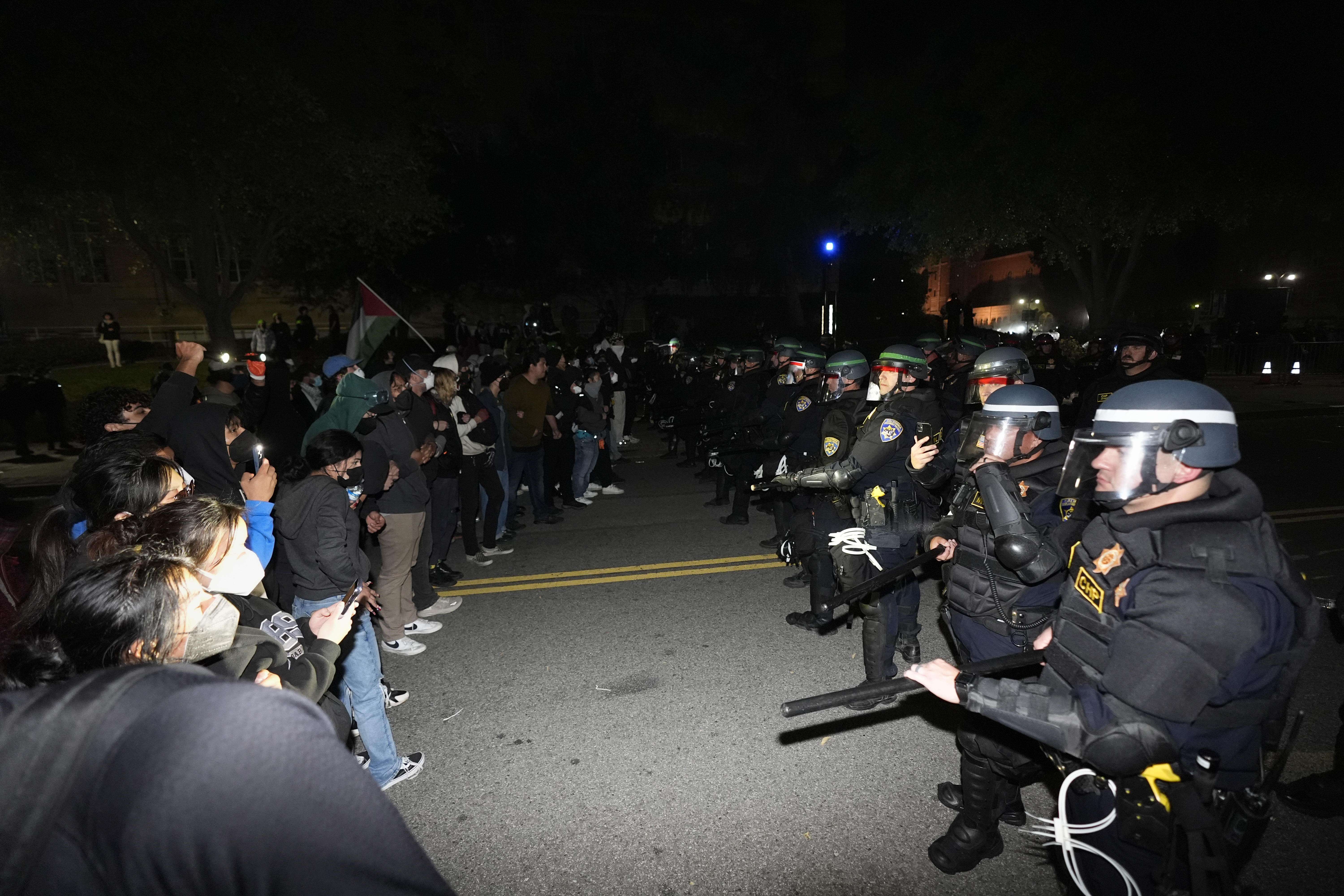 Police advance on demonstrators on the UCLA campus Thursday, May 2, 2024, in Los Angeles. (AP Photo/Ryan Sun)