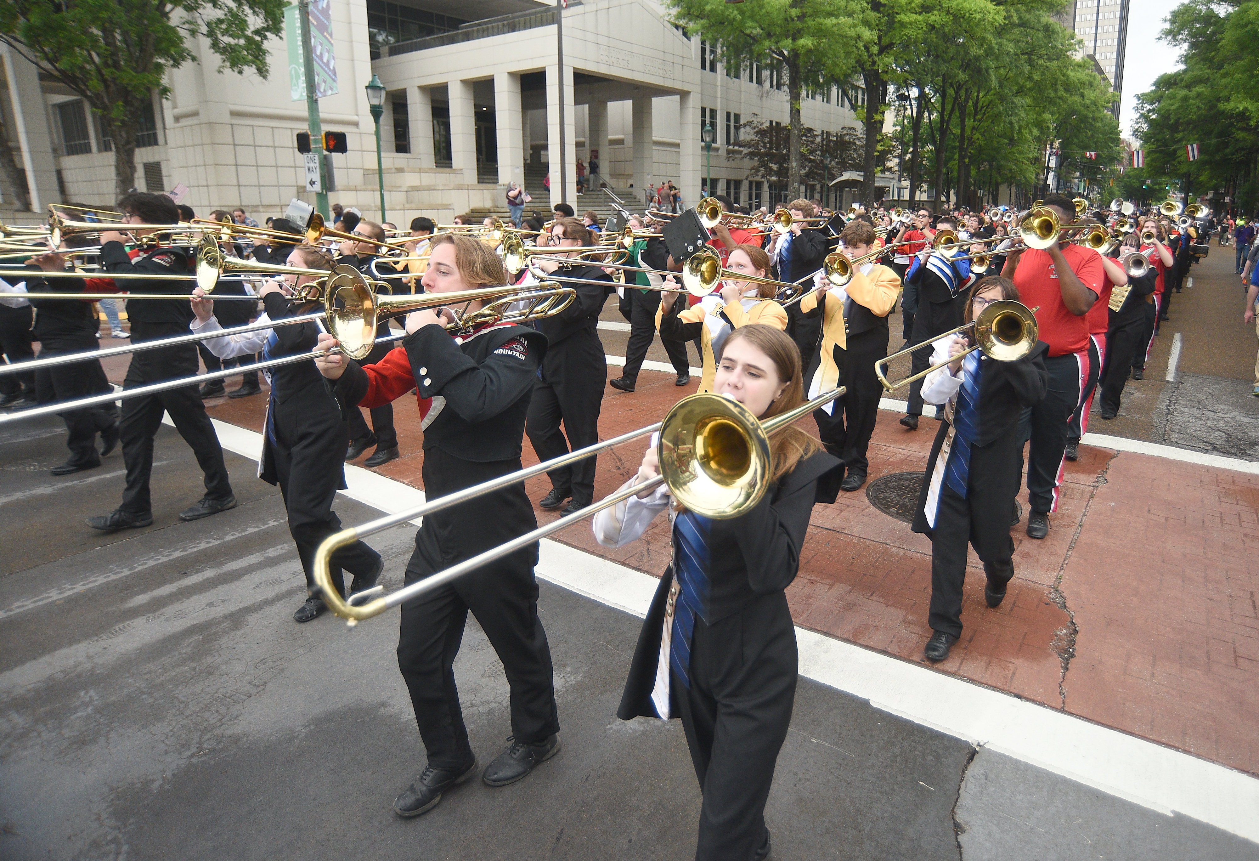 Staff photo by Matt Hamilton/ Members of various high school bands perform together on Market Street during the 75th Armed Forces Day Parade on Friday, May 3, 2024.