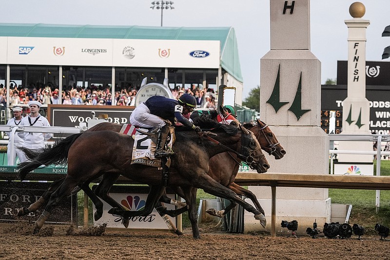 Sierra Leone (2, front) with jockey Tyler Gaffalione, Forever Young with jockey Ryusei Sakai, and Mystik Dan with jockey Brian Hernandez Jr. cross the finish line at Churchill Downs in Louisville, Ky., during the 150th running of the Kentucky Derby on Saturday, May 4, 2024. (AP/Kiichiro Sato)