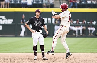 Arkansas Jayson Jones (13) reacts as he scores a run, Sunday, May 12, 2024 during the sixth inning of a baseball game at Baum-Walker Stadium in Fayetteville. Visit nwaonline.com/photos for today's photo gallery...(NWA Democrat-Gazette/Charlie Kaijo)