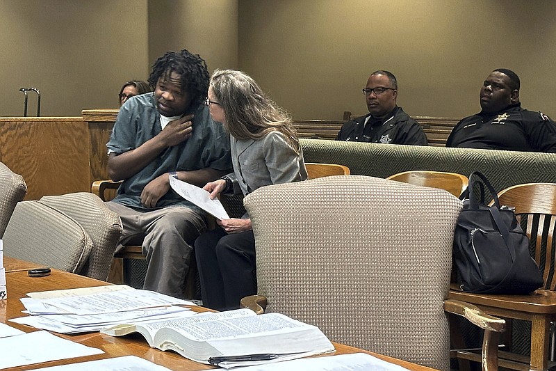 Cleotha Abston (left) speaks with his lawyer Friday during his sentencing hearing for an April rape conviction in Memphis, Tenn.
(AP/Adrian Sainz)