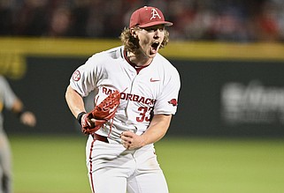 Arkansas Hagen Smith (33) reacts, Friday, March 15, 2024 during the sixth inning of a baseball game at Baum-Walker Stadium in Fayetteville. Visit nwaonline.com/photos for today's photo gallery...(NWA Democrat-Gazette/Charlie Kaijo)