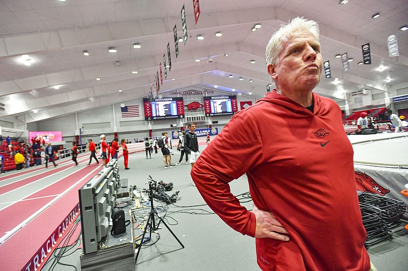 Arkansas head men’s track and field coach Chris Bucknam looks on, Saturday, Feb. 24, 2024, following the Razorbacks’ sweep at the 2024 SEC Indoor Track and Field Championships inside the Randal Tyson Track Center in Fayetteville. (Hank Layton/NWA Democrat-Gazette)