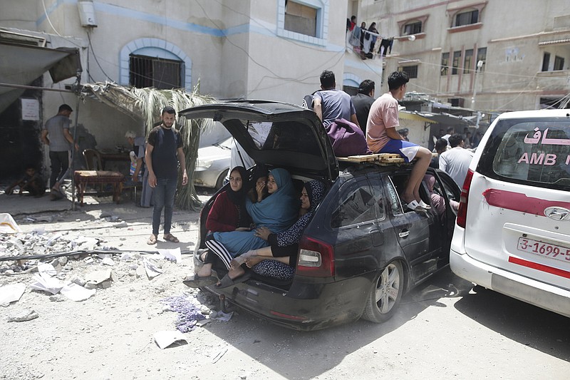 Palestinians evacuate dead and wounded in the Israeli bombardment of the Gaza Strip in Deir al Balah on Saturday, June 8, 2024. (AP/Jehad Alshrafi)