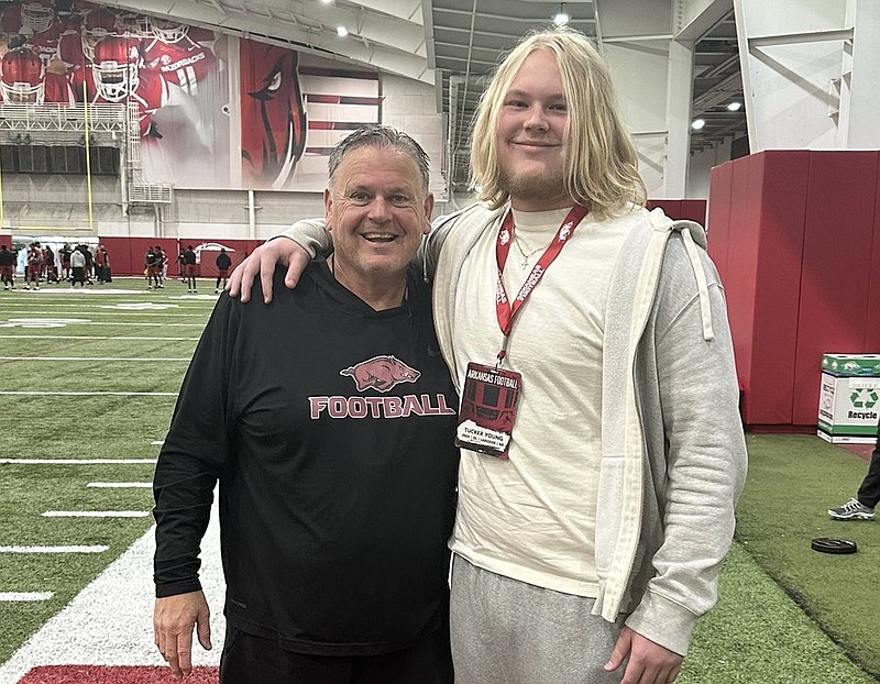 Arkansas coach Sam Pittman and offensive lineman Tucker Young.