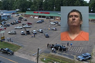 Travis Eugene Posey (inset), 44, of New Edinburg in Cleveland County is shown in a booking photo released Friday, June 21, 2024. Posey was arrested after a mass shooting at the Mad Butcher grocery store in Fordyce, where evidence markers and police tape can be seen in the parking lot as law enforcement officers work the scene Friday. (Main, Arkansas Democrat-Gazette/Colin Murphey; inset, Ouachita County sheriff's office courtesy photo)