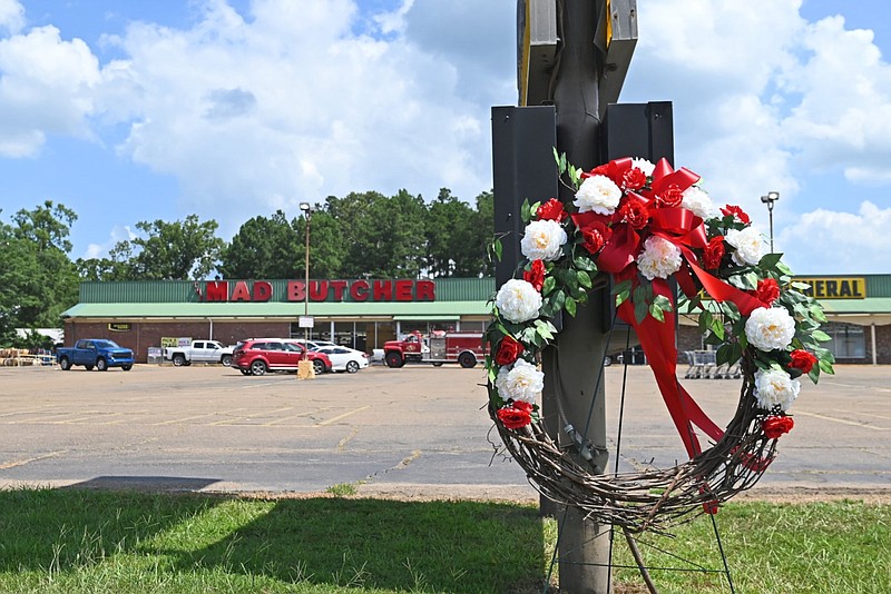 A wreath is displayed Saturday, June 22, 2024, outside the Mad Butcher in Fordyce. The wreath is in honor of the victims of a mass shooting that occurred the previous day at the grocery store. (Arkansas Democrat-Gazette/Staci Vandagriff)