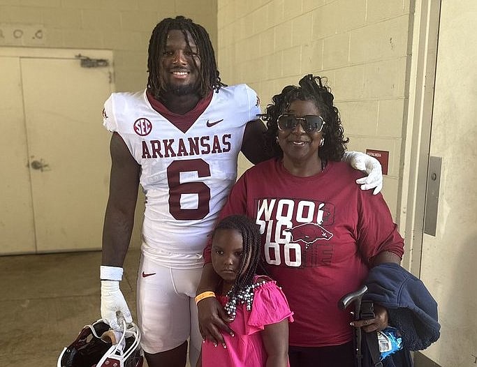 Arkansas DE Kavion Henderson, his grandmother Rhonda Henderson and hs cousin Eumekia during spring practice.