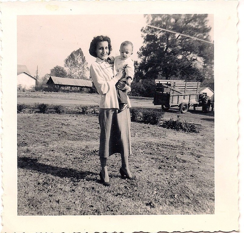 Rosalie Santine Gould holds her son, Clayton, in the backyard of their Rohwer home around 1952.
(Special to the Democrat-Gazette)