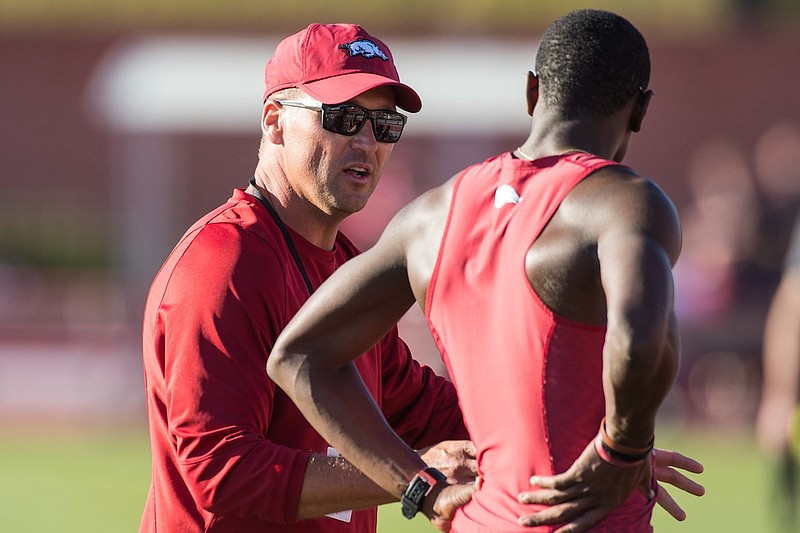 Travis Geopfert (left) has spent 12 highly successful seasons as an assistant coach at Arkansas. (Photo courtesy Arkansas Athletics)