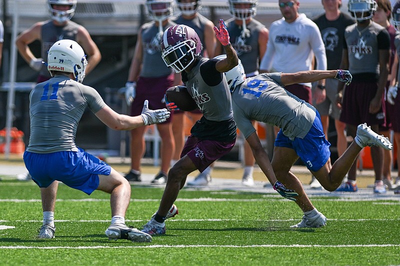 Jenks, Okla., receiver Kayleb Barnett runs after a catch during the championship game of the Southwest Elite 7-on-7 Showcase on Friday at Shiloh Christian’s Field of Champions in Springdale. Jenks defeated Rogers for the title.
(NWA Democrat-Gazette/Caleb Grieger)