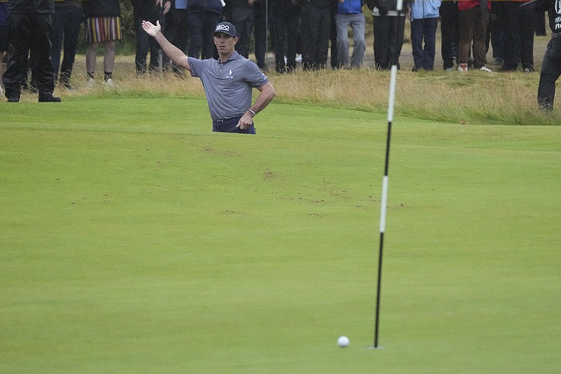 Billy Horschel of the United States reacts Saturday as his ball only just fails to drop following a shot from a bunker on the 16th hole during his third round of the British Open at Royal Troon Golf Club in Troon, Scotland. Horschel holds a one-shot lead heading into the final round.
(AP/Jon Super)