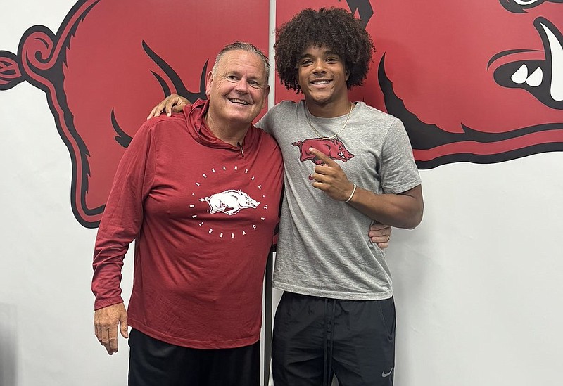 Arkansas coach Sam Pittman and Fayetteville DB Kyndrick Williams.