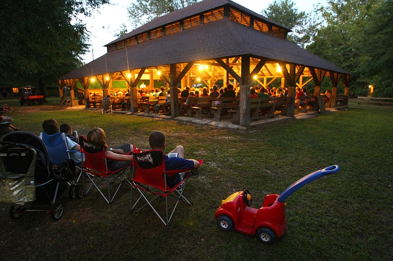 Campgoers gather in 2009 for worship in the open-air tabernacle at Davidson Campground west of Arkadelphia. The ten-day revival, which began Friday, continues through Aug. 4.
(Arkansas Democrat-Gazette file photo/Stephen B. Thornton)