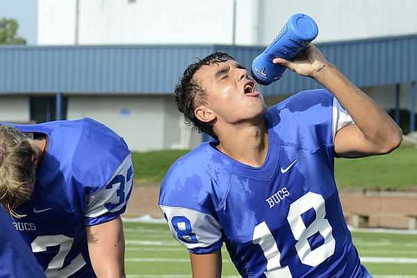 As practice amps up, prep football teams prepare to combat heat
