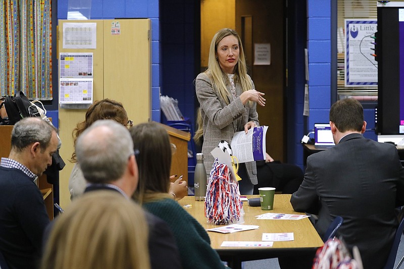 Jessica Sliwerski (center), the chief executive officer and co-founder of the Ignite! Reading company, explains her company's literacy-tutoring program at Western Hills Elementary School in Little Rock in this Feb. 21, 2024, file photo. Western Hills Elementary this spring completed its third semester of the Ignite program as part of its daily literacy instruction block of time. The Little Rock School District has placed the school in network 3, the tier of greatest district support. (Arkansas Democrat-Gazette/Thomas Metthe)