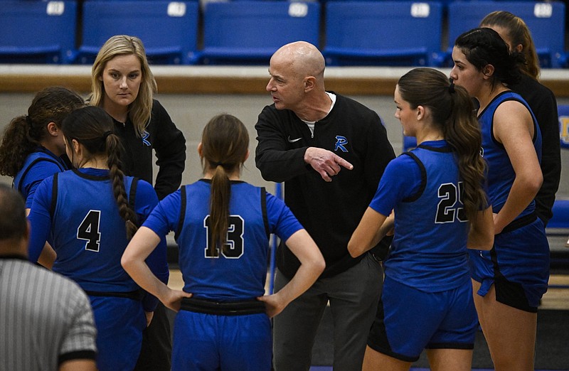 Preston Early, head coach of the Rogers High School girls basketball team, talks with his team during a timeout in the first half of their game against Cabot in the Class 6A state tournament at North Little Rock High School in this Feb. 28, 2024, file photo. (Arkansas Democrat-Gazette/Stephen Swofford)