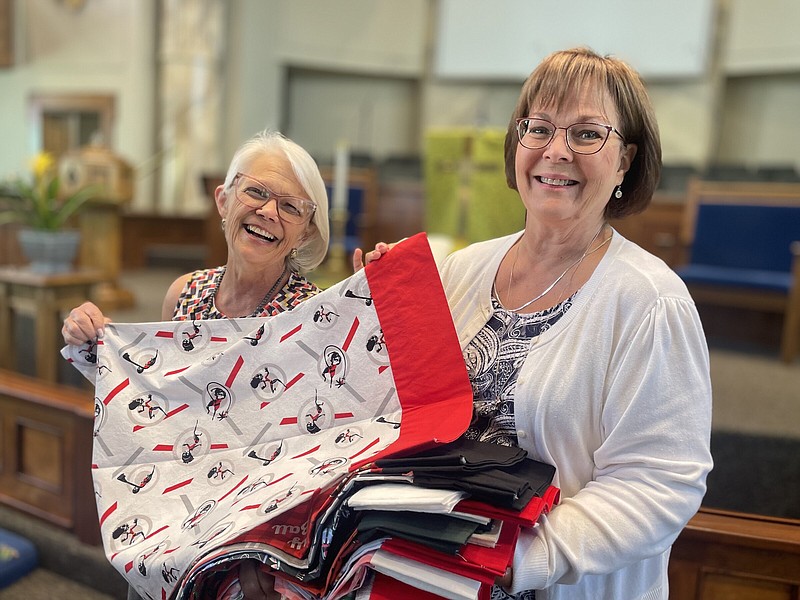 Linda Clarke (left) and Pam Dunivan hold up a pillowcase created by members of the Jonesboro First United Methodist Church sewing ministry. It’s one of the hundreds the group has created to give to patients at Arkansas Children’s Hospital in Little Rock.
(Arkansas Democrat-Gazette/Frank E. Lockwood)