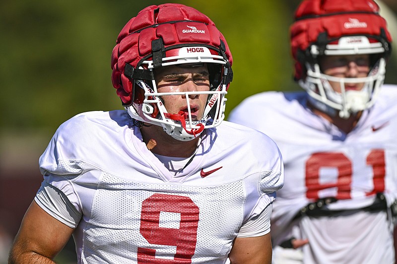 Arkansas tight end Luke Hasz (left) was off to a sensational start last season before a broken collarbone against Texas A&M sidelined him, but his return to health — and that of fellow tight end Ty Washington — may have a bigger benefit for the Razorbacks in the long run. “I think it just created our bond together and the tight end room bond stronger. I think we had just a great time working back and we’re definitely both excited to be back out there,” Hasz said.
(NWA Democrat-Gazette/Hank Layton)