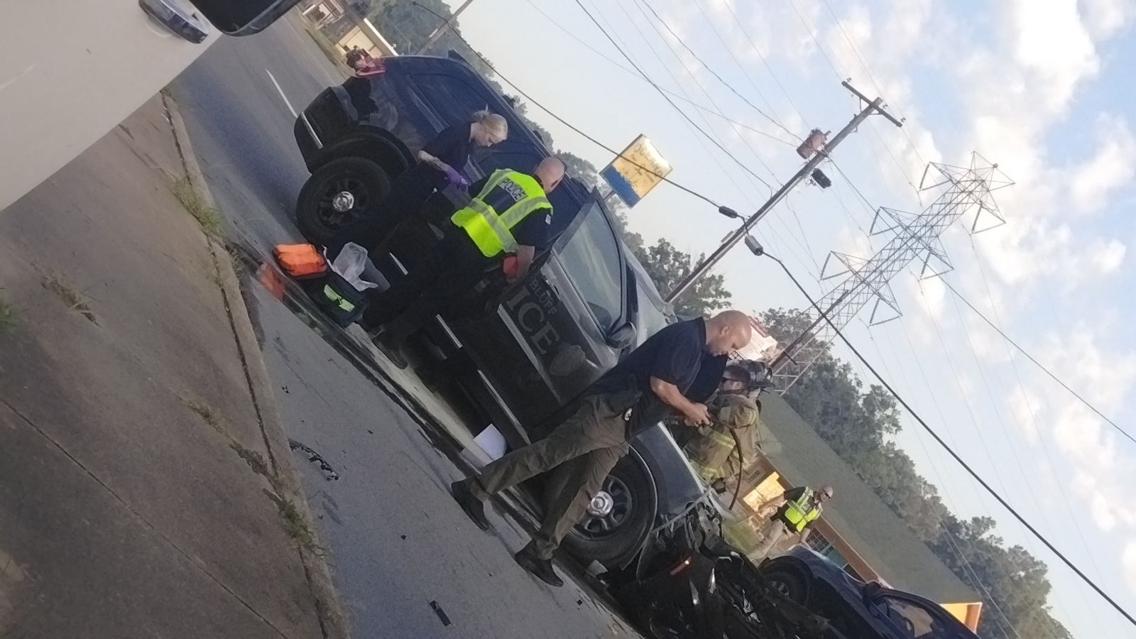 PB police officer injured when patrol car hits bus
