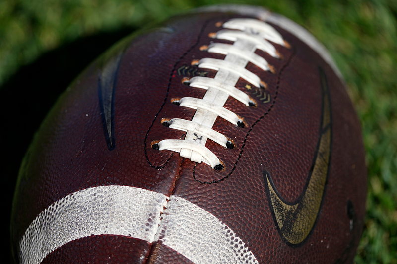 A football sits on the field before an NCAA college football game, Saturday, Nov. 5, 2022, in Ames, Iowa. (AP Photo/Charlie Neibergall)