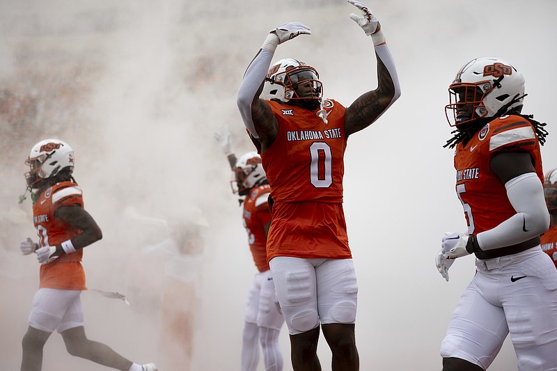 Oklahoma State moves up, Arkansas receives vote in AP football poll