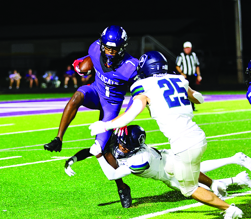 El Dorado's AJ Gilmore tries to get out of the grasp of a Little Rock Christian defender. The Wildcats are 2-1 going into a bye week after winning at Texarkana 42-20 on Friday.