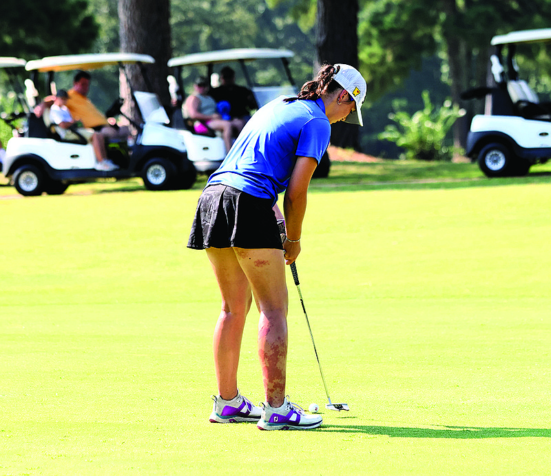 Parkers Chapel's Lorali Barnes strikes a putt during action this season at the Lions Club.