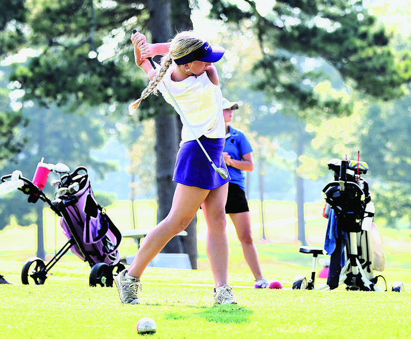 Junction City's Valarie Kidwell hits a tee shot in action this season. The Lady Dragons will compete in the 2A State Golf Tournament Tuesday at Glenwood Country Club.